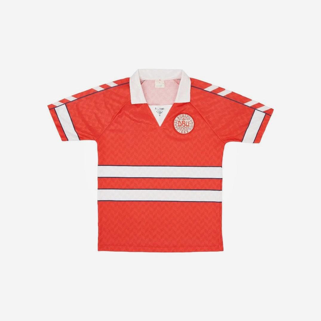 The Retro1999 Denmark 1988 Home Shirt is a red short-sleeve jersey with white and black stripes, a white collar, and a classic circular logo—ideal for fans of retro kit and national team apparel.