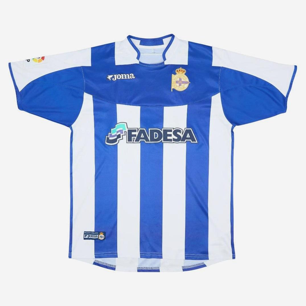 The Retro1999 Deportivo 2003-04 Home Shirt features blue and white stripes, short sleeves, the club crest, Joma logo, and Fadesa sponsor—an iconic retro kit for any fan.