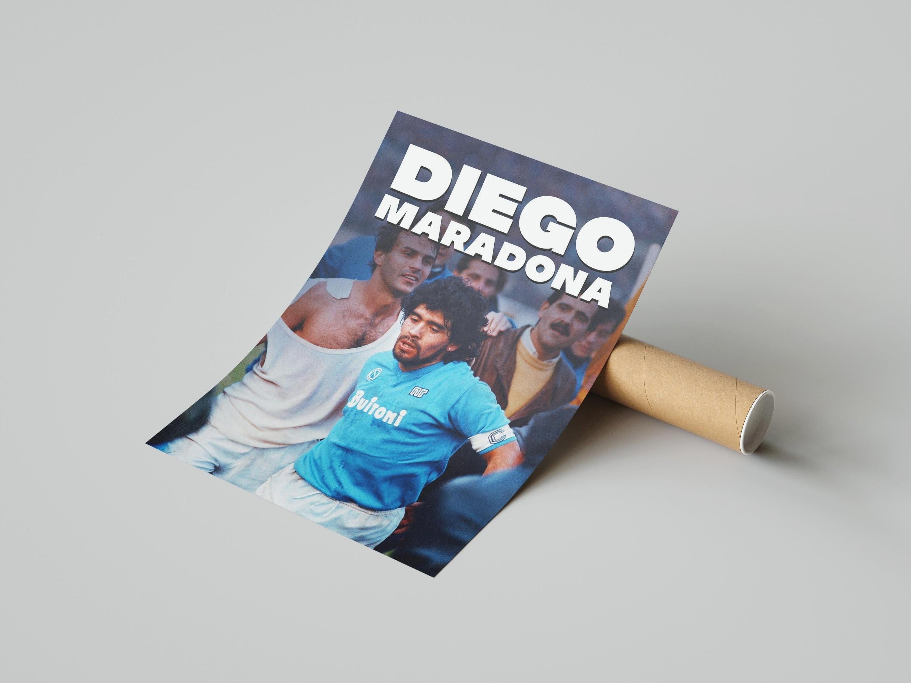 The Retro1999 Diego Maradona Napoli Poster shows the football legend in a blue jersey with bold white text, partially unrolled on a light surface—a must-have piece of football history.