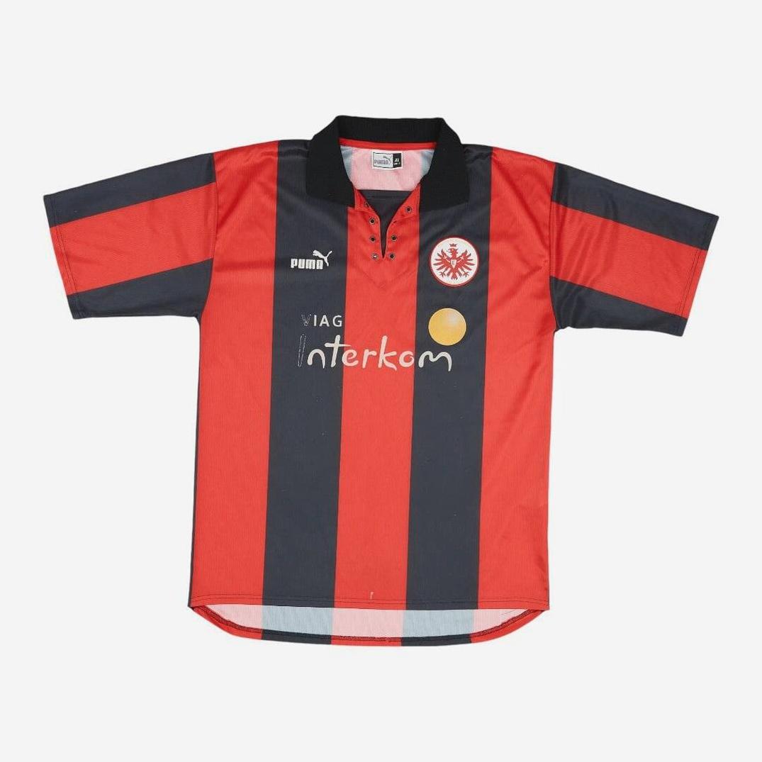The Retro1999 Frankfurt 1999-00 Home Shirt features classic red and black vertical stripes, short sleeves, a black collar, Puma logo, club crest, and VIAG Interkom sponsor—ideal for Bundesliga and Eintracht Frankfurt fans.