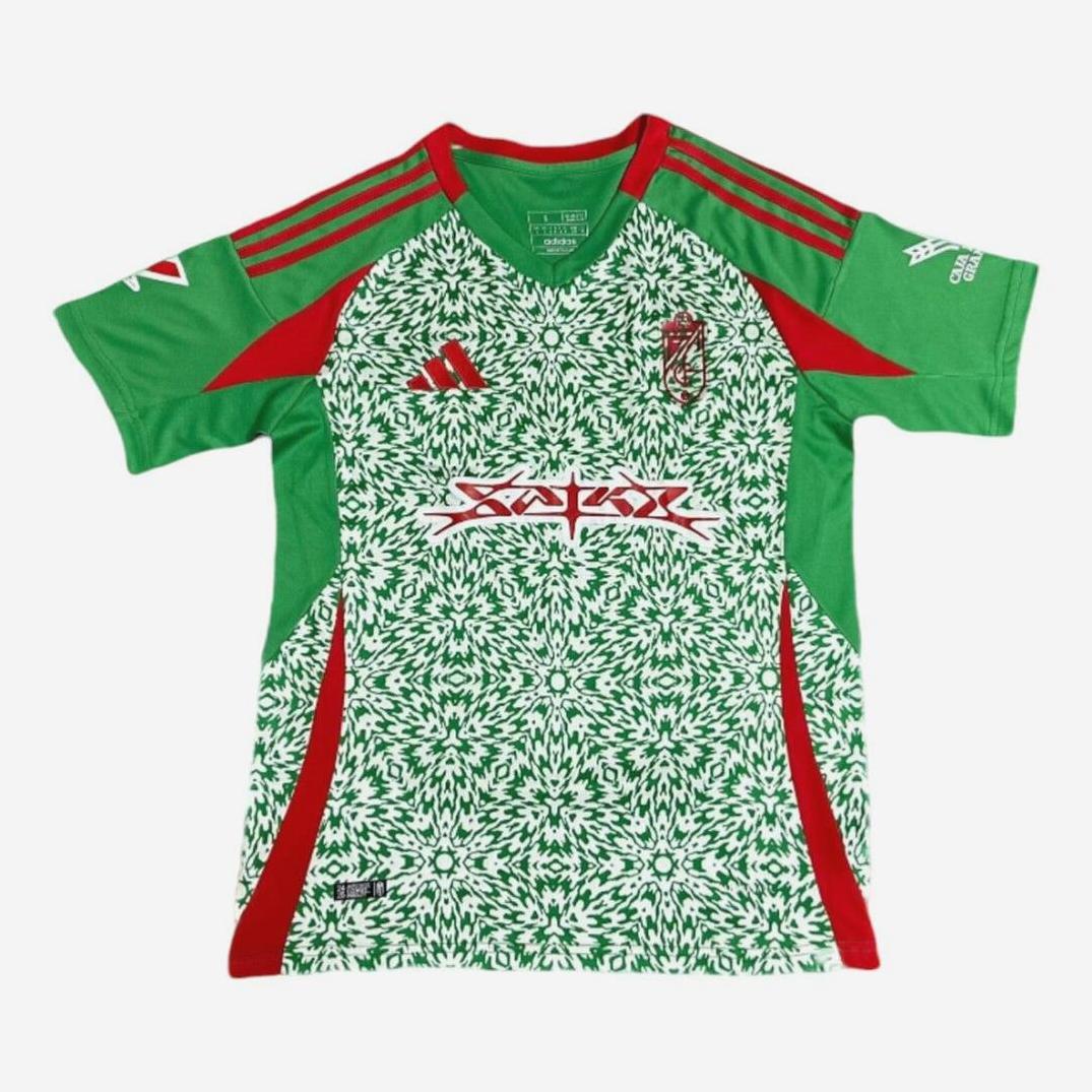 The Granada CF 2024-25 Third Shirt by Retro1999 is a short-sleeved soccer jersey with a green and white kaleidoscope front, red accents on shoulders and sides, green sleeves, plus red and white logos on the chest and sleeves.