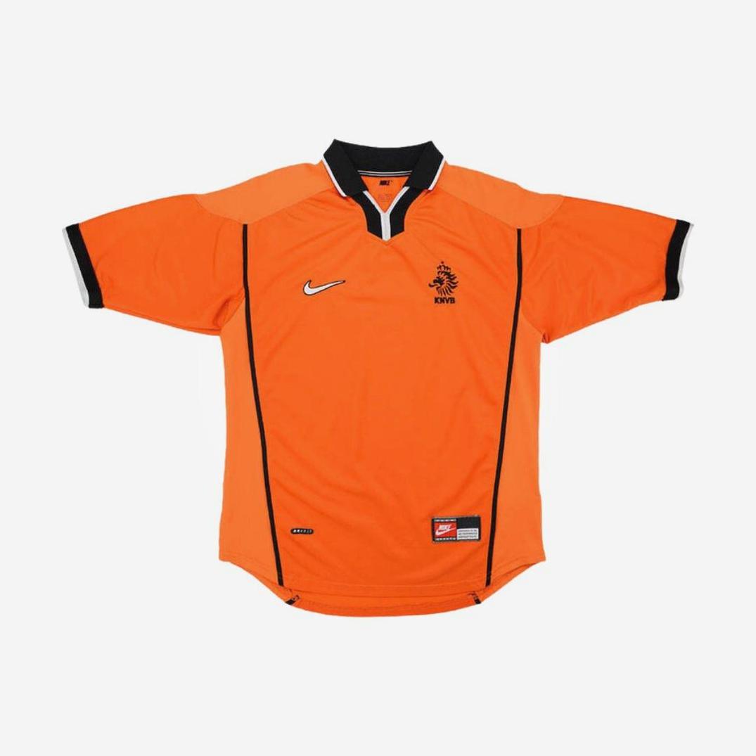 The Retro1999 Holland 1998 Home Shirt is an orange short-sleeve jersey with black trim, a black collar, and chest logos—capturing the iconic style of the Netherlands national football teams classic kit.