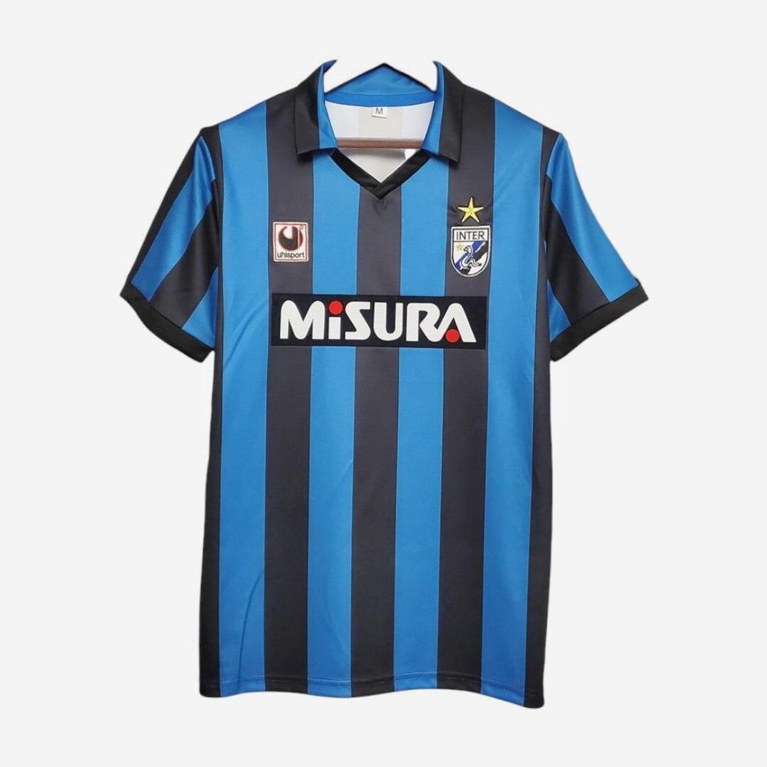 The Retro1999 Inter Milan 1988-90 Home Shirt features iconic black and blue stripes, MISURA sponsor logo, club badge with gold star, ideal for Serie A fans. Shown on a white background.