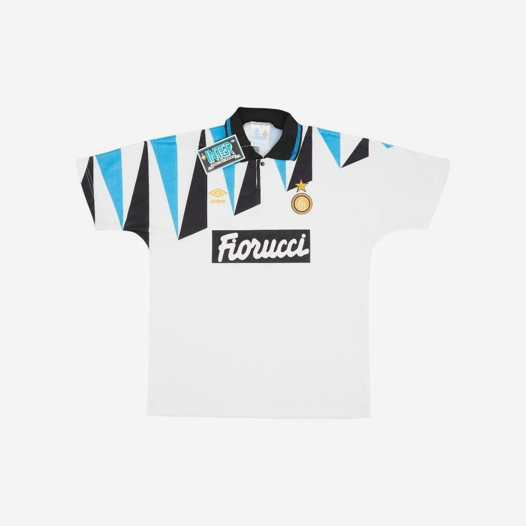 The Retro1999 Inter Milan 1992-93 Away Shirt features a white base, blue and black shoulder triangles, black collar, Fiorucci sponsor logo, club badge, and Umbro logo—ideal retro memorabilia for fans.