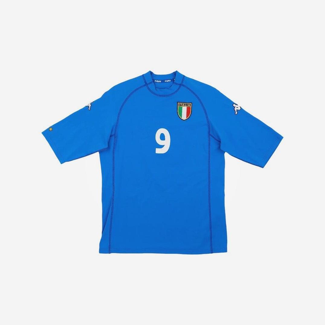 The Retro1999 Italy 2000 Home Shirt is a blue short-sleeve jersey featuring number 9, an Italian crest on the left chest, and Kappa logos on both sleeves—a classic retro kit displayed flat on a white background.