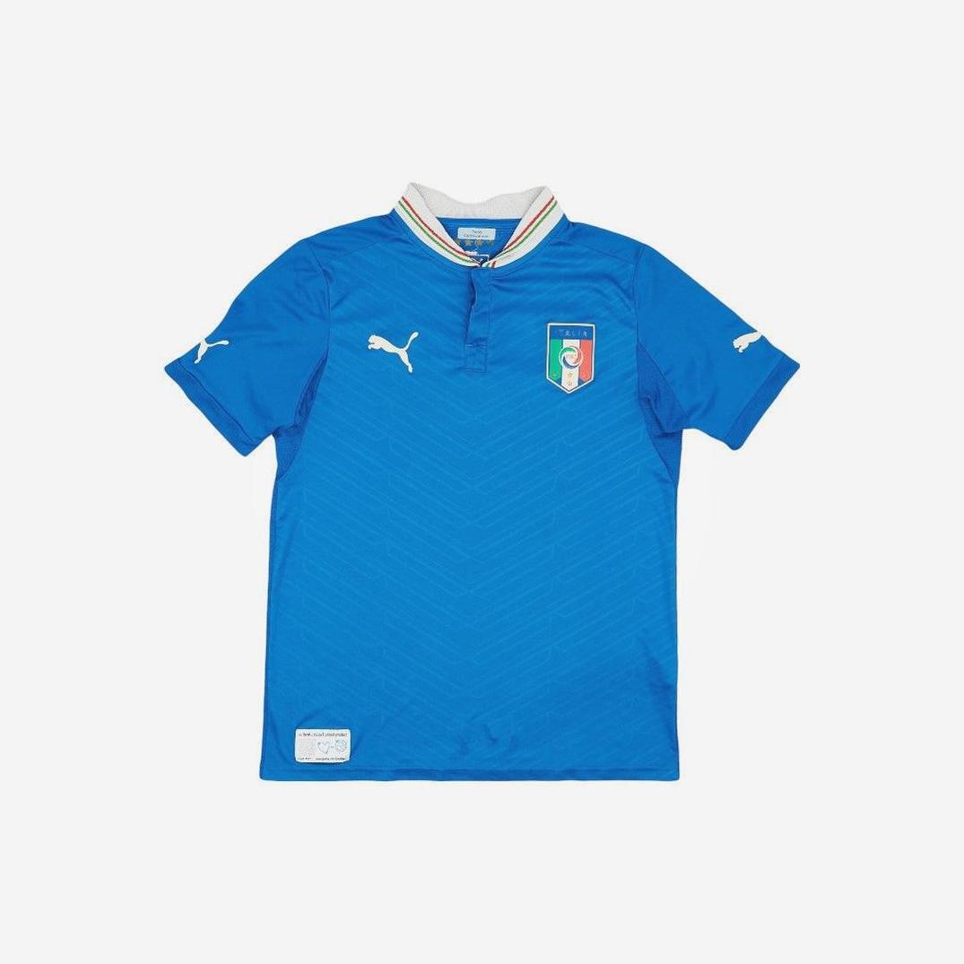 The Retro1999 Italy 2012 Home Shirt features white Puma logos, an Italy crest, and a white collar with red and green stripes. This standout retro kit is showcased on a plain white background, celebrating football heritage.