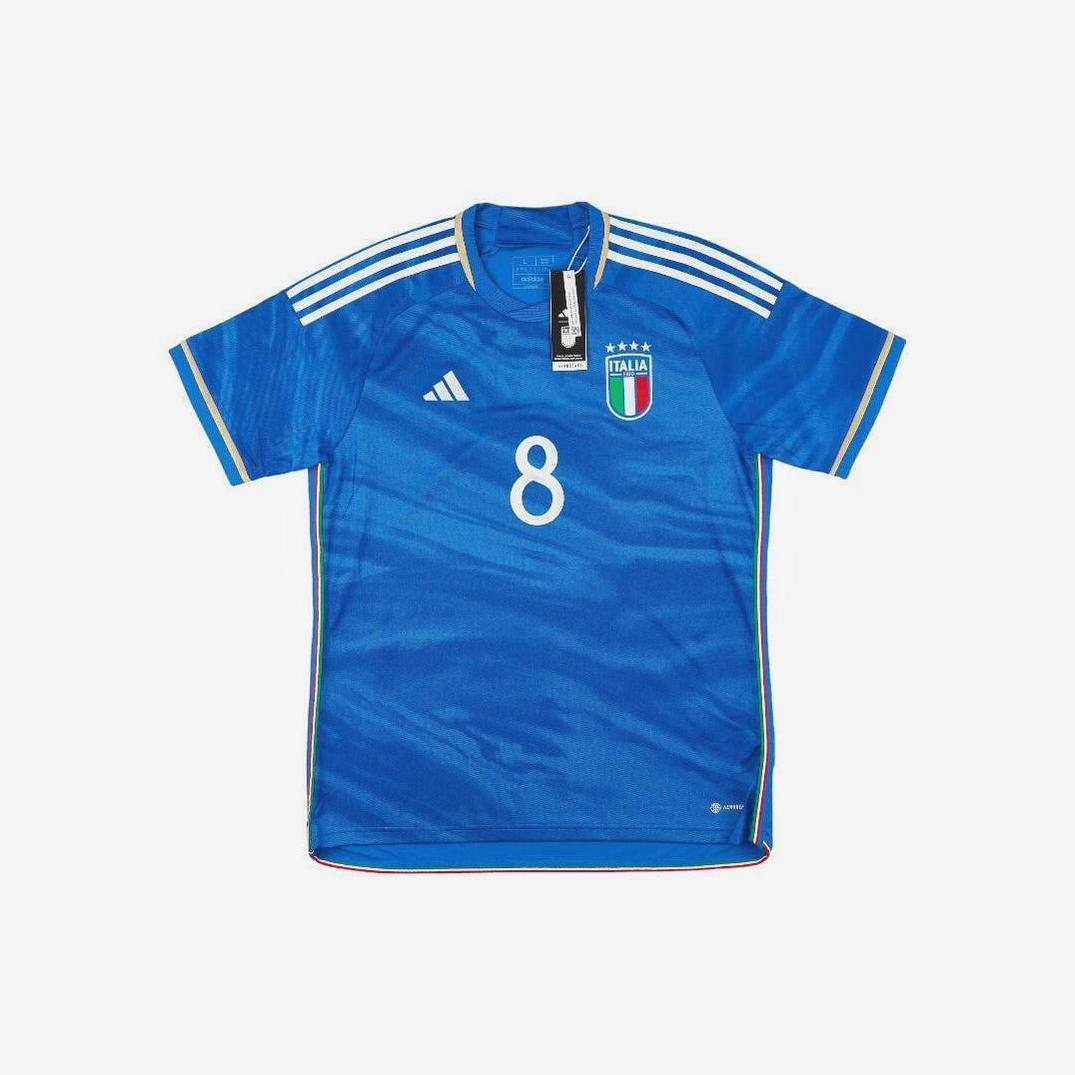 The Retro1999 Italy 2023 Home Shirt in blue features number 8, a white Adidas logo, team crest on the chest, gold sleeve trim, and three white shoulder stripes—a retro-inspired Italian football kit shown on a white background.