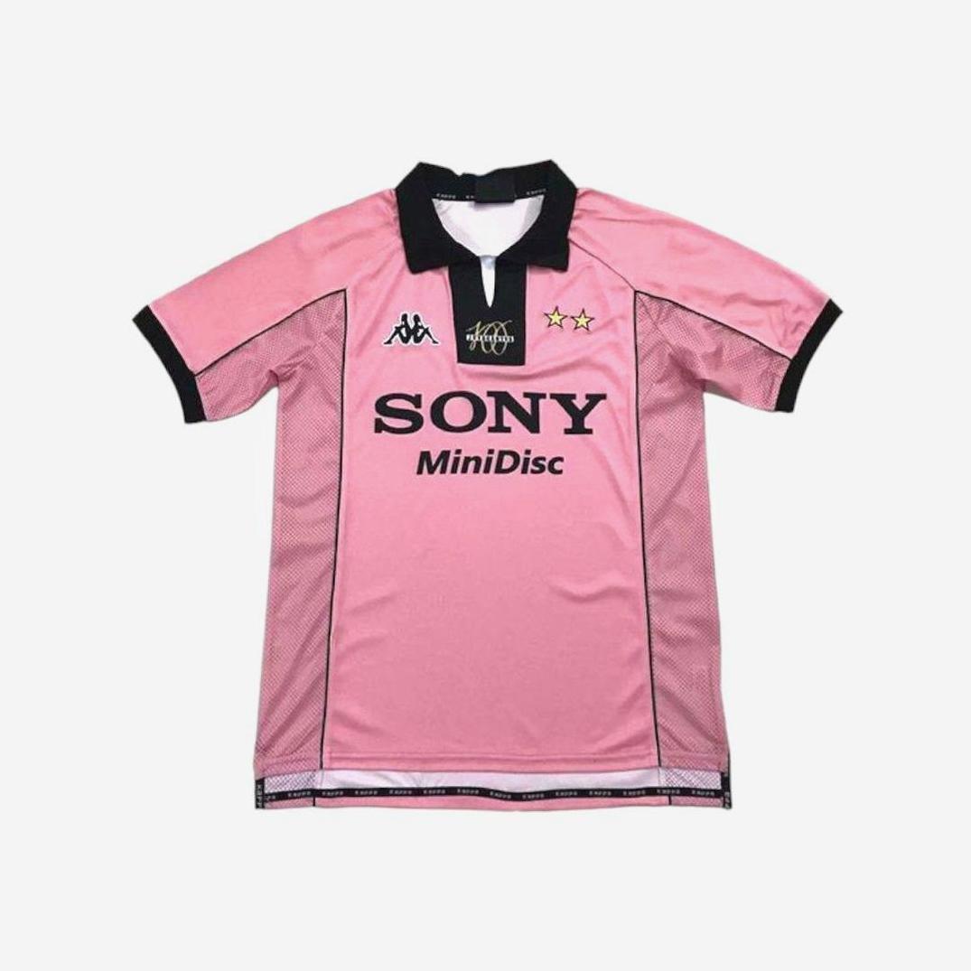 The Retro1999 Juventus 1997-98 Away Shirt features pink with black trim, Kappa logo, two gold stars, and SONY MiniDisc sponsor—a classic Serie A retro kit.