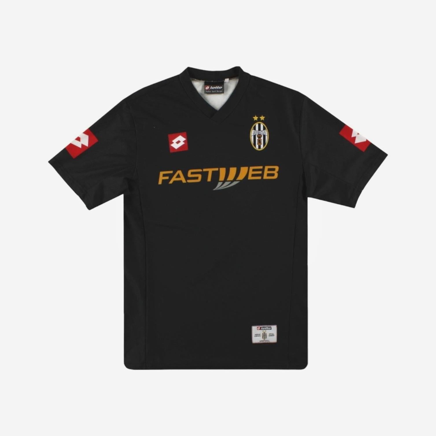 The Retro1999 Juventus 2001-02 Away Shirt is a black retro kit featuring the yellow FASTWEB sponsor, Lotto branding, and a club crest with two gold stars—honoring Juve’s Serie A victories with authentic vintage style.