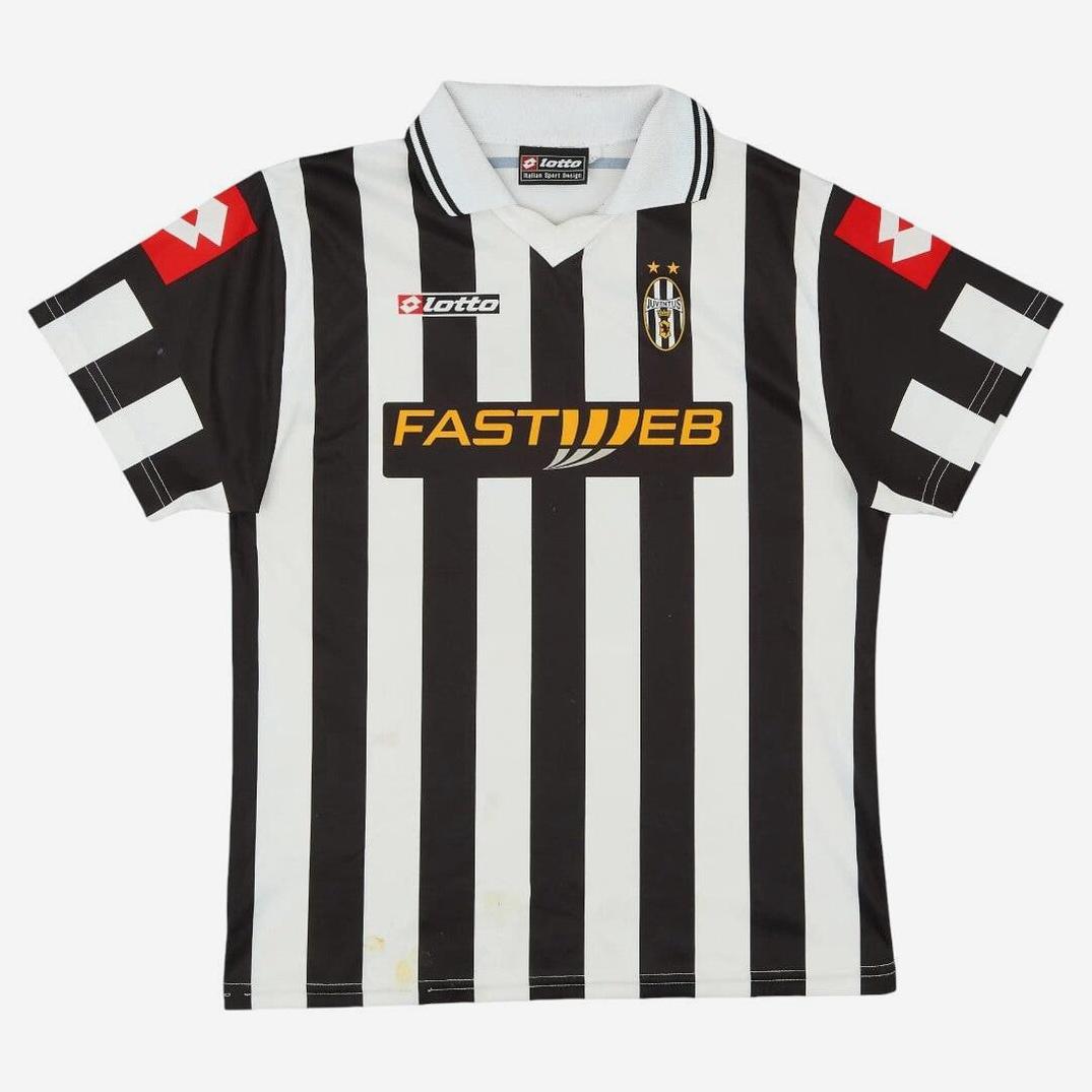The Retro1999 Juventus 2001-02 Home Shirt features black and white stripes, a white collar, Lotto and Fastweb logos on the chest, red Lotto sleeve logos—a classic retro kit from the iconic Serie A club.