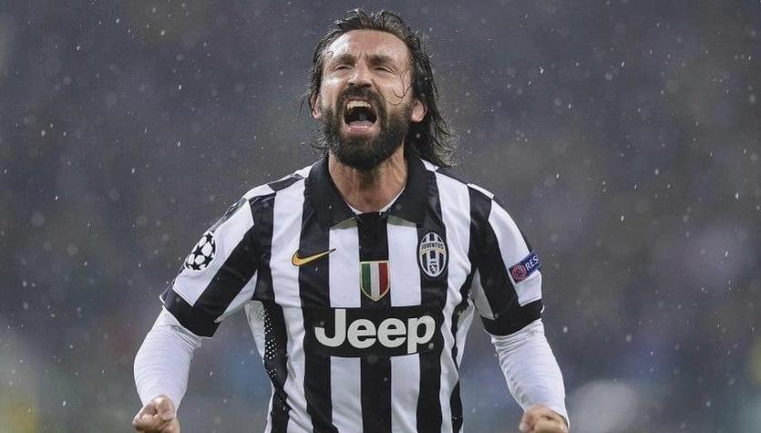 A soccer player in the Retro1999 Juventus 2014-15 Home Shirt celebrates passionately in the rain, fists clenched—a powerful scene for any collection of Juventus memorabilia.