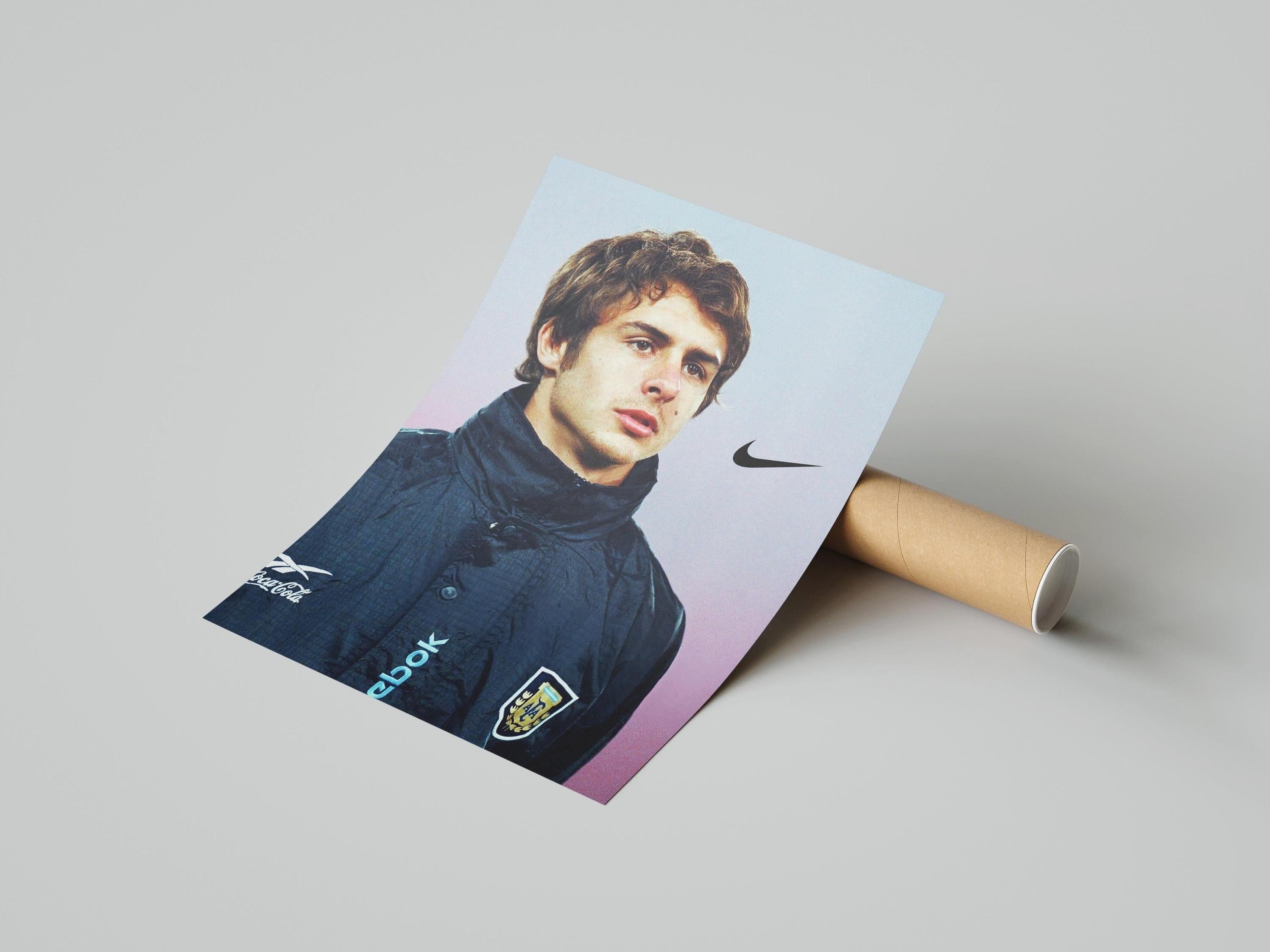 A rolled-up Pablo Aimar Portrait Poster by Retro1999 lies on a flat surface, featuring Aimar in a dark high-collared jacket. This collectible is perfect for fans of Argentina football history and makes a unique sports memorabilia piece.