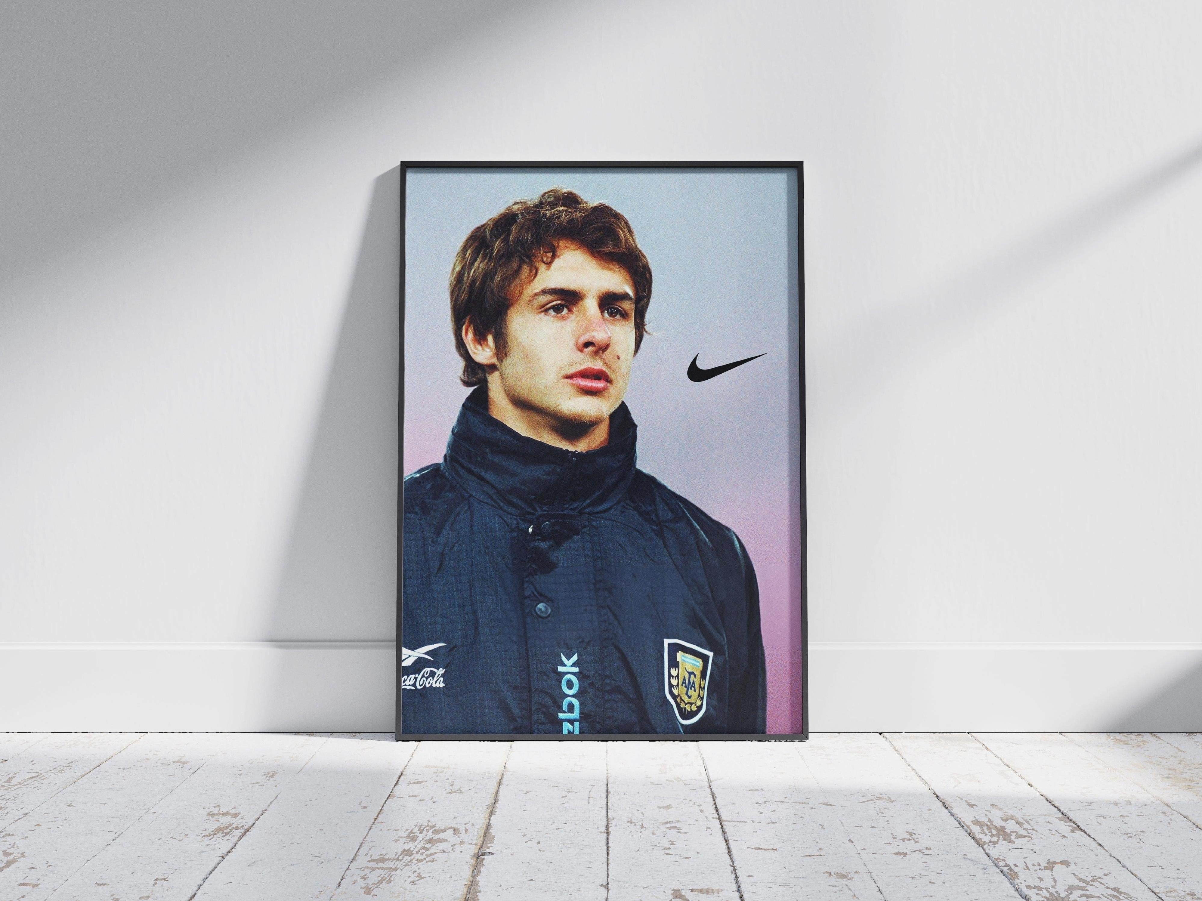 The Pablo Aimar Portrait Poster by Retro1999 features the famed footballer in an Argentina jacket with a Nike logo, set against a plain background—perfect sports memorabilia for fans and a tribute to Argentina’s football legacy.