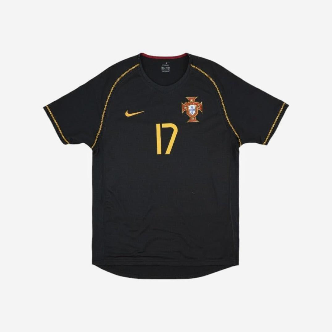 The Retro1999 Portugal 2006 Away Shirt in black with yellow accents features the number 17, national team crest, and yellow Nike logo—a classic retro kit for any Portuguese football fan.