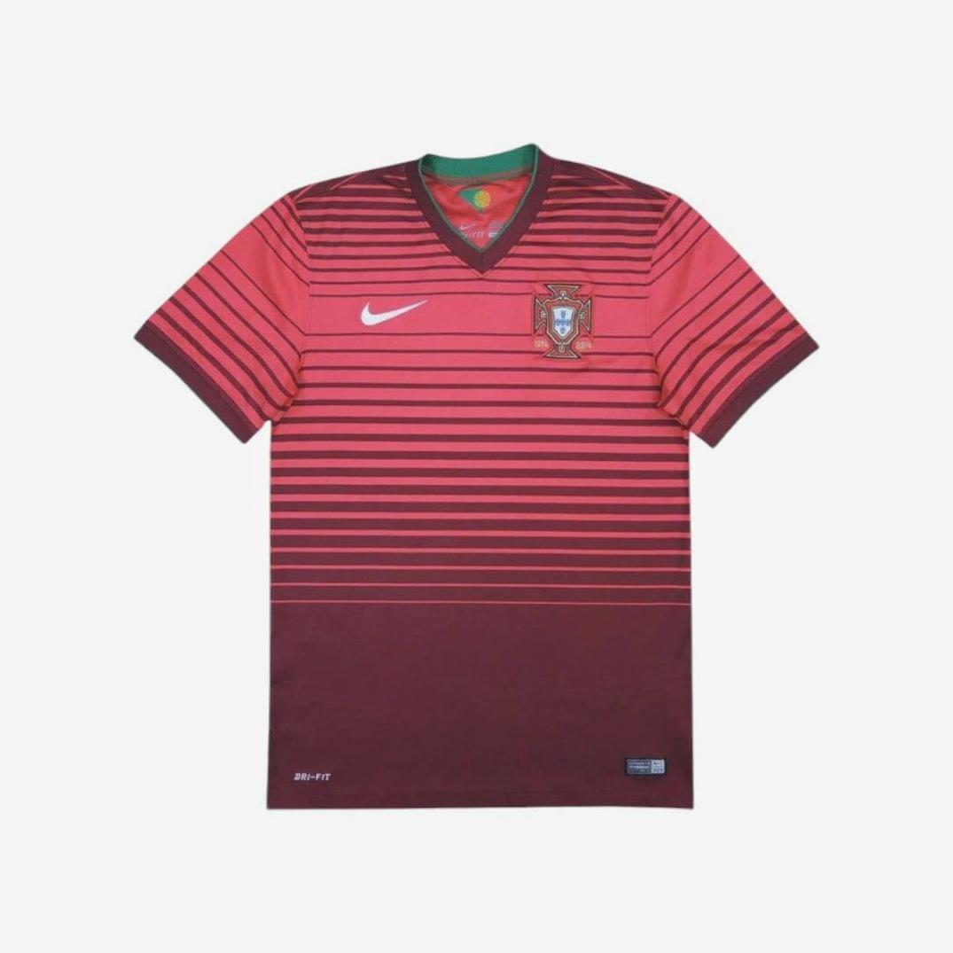 The Portugal 2014 Home Shirt by Retro1999 features red and burgundy stripes, a Nike logo on the right chest, and the team crest on the left, displayed on a plain white background—a classic kit for football fans.