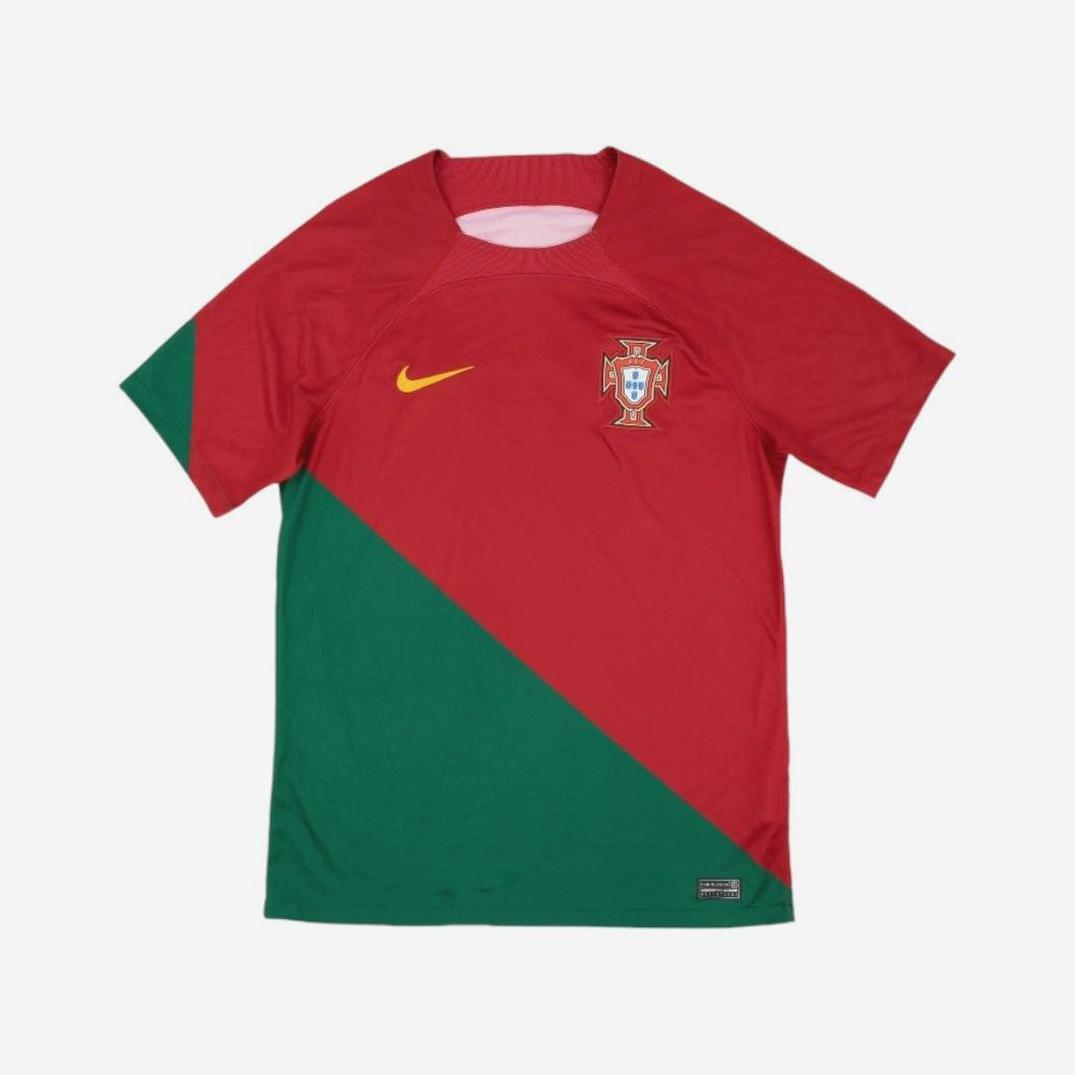 The Retro1999 Portugal 2022 Home Shirt features red and green diagonal halves, a yellow Nike logo, and the Portugal National team crest on the chest, inspired by a classic retro kit.
