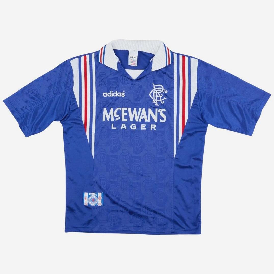Blue short-sleeved Rangers F.C. 1996-97 Home Shirt by Retro1999, featuring white/red shoulder stripes, white collar, and “McEwan’s Lager” sponsor—a classic choice for fans of this iconic retro kit.