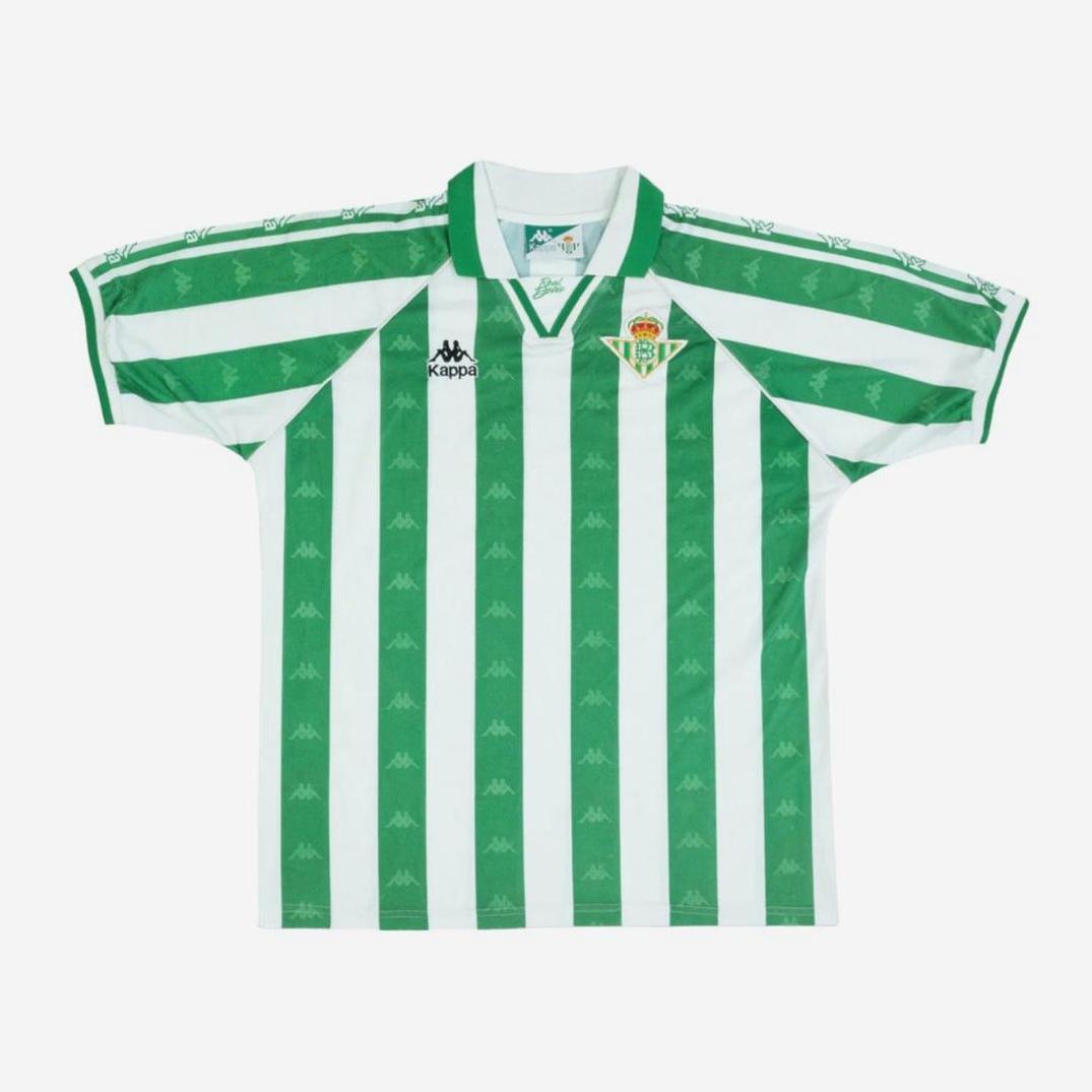 The Real Betis 1995-98 Home Shirt by Retro1999 features green and white stripes, short sleeves, a collar, and the club crest—ideal for La Liga fans and retro football shirt collectors.
