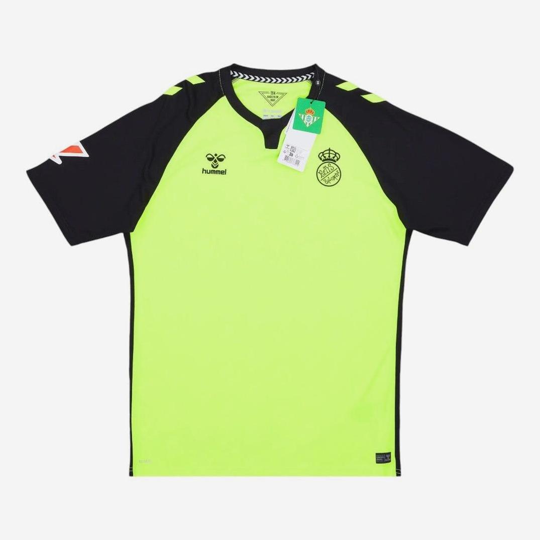The Retro1999 Real Betis 2024-25 Away Shirt in neon yellow and black features a crest, Hummel logo, and green collar tag, laid flat on a white background—a standout retro La Liga kit.
