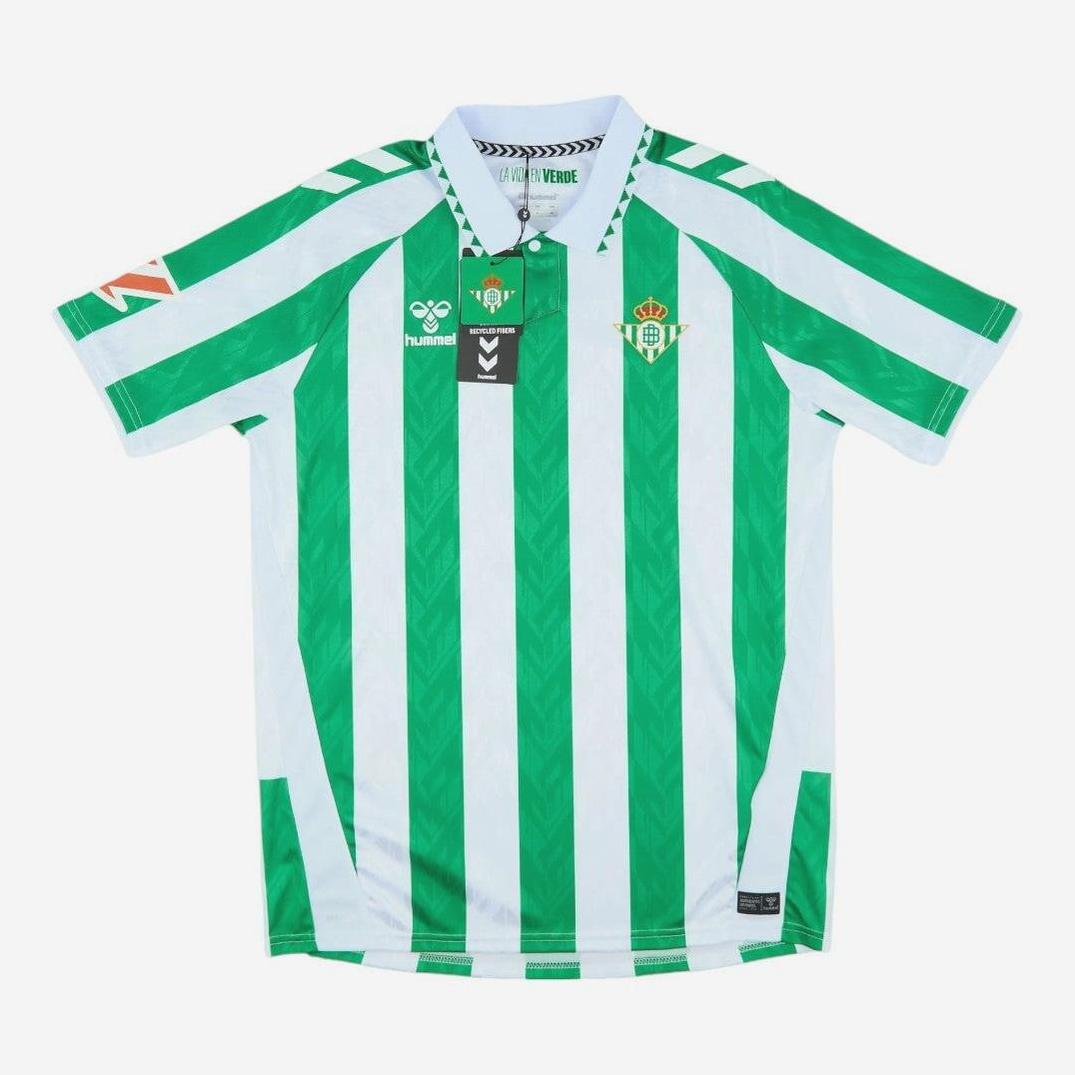 The Retro1999 Real Betis 2024-25 Home Shirt features green and white vertical stripes, a collar, chevron shoulders, Hummel logo, club crest, and sponsor patches, shown on a plain white background.