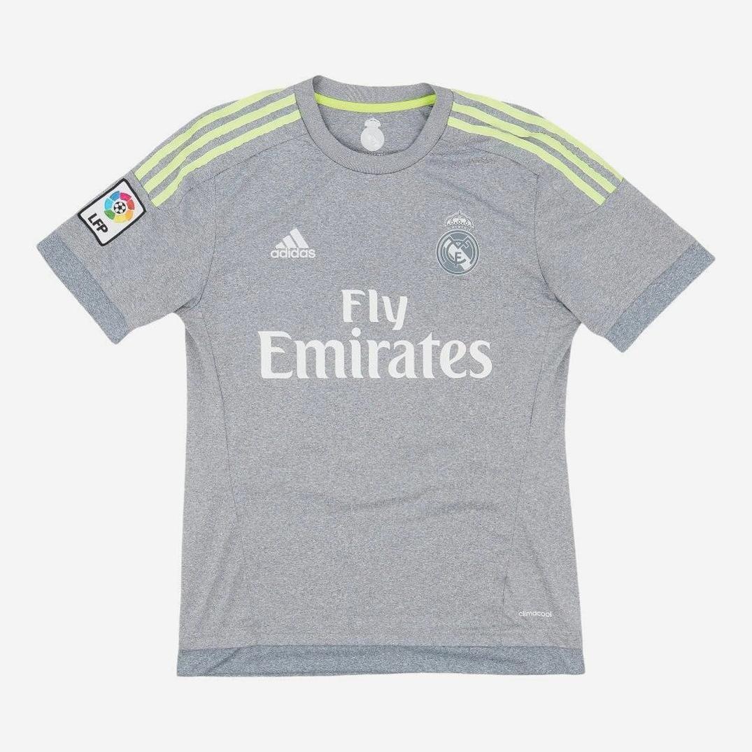 The Retro1999 Real Madrid 2015-16 Away Shirt is gray with neon yellow Adidas stripes, Fly Emirates sponsor logo, and a La Liga patch on the right sleeve, shown laid flat on a white background.