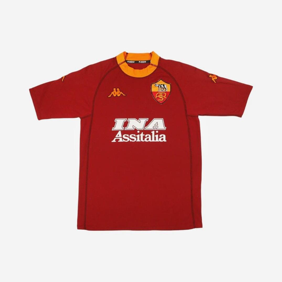 The Retro1999 Roma 2000-01 Home Shirt features red with yellow accents, a Kappa logo, club crest, and INA Assitalia sponsor printed on the chest—a classic retro Serie A kit.