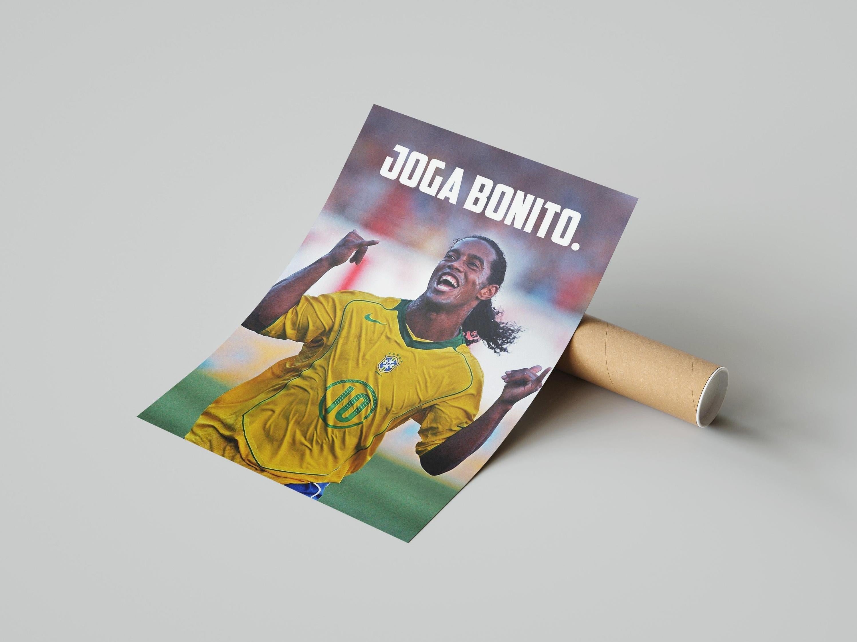 A must-have for any football fan, the Retro1999 Ronaldinho Joga Bonito Poster 2 shows the joyful Brazilian legend in a yellow jersey with JOGA BONITO. at the top, set against a light background and supplied in a sturdy tube.