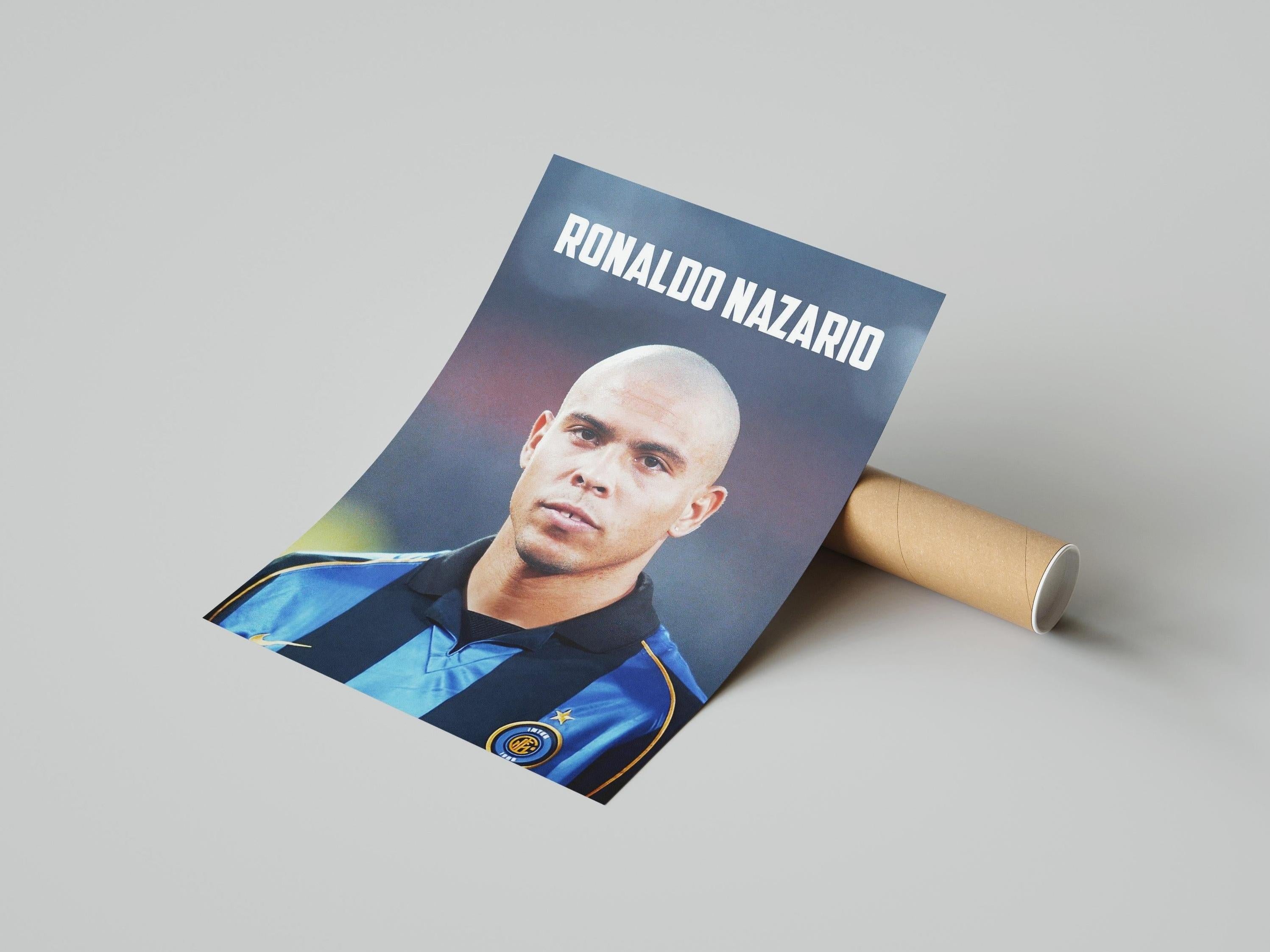 The Retro1999 Ronaldo Nazario Inter Poster is perfect for football fans, featuring Ronaldo in a blue and black jersey with his name above the image. Comes displayed beside a cardboard tube on a plain background.