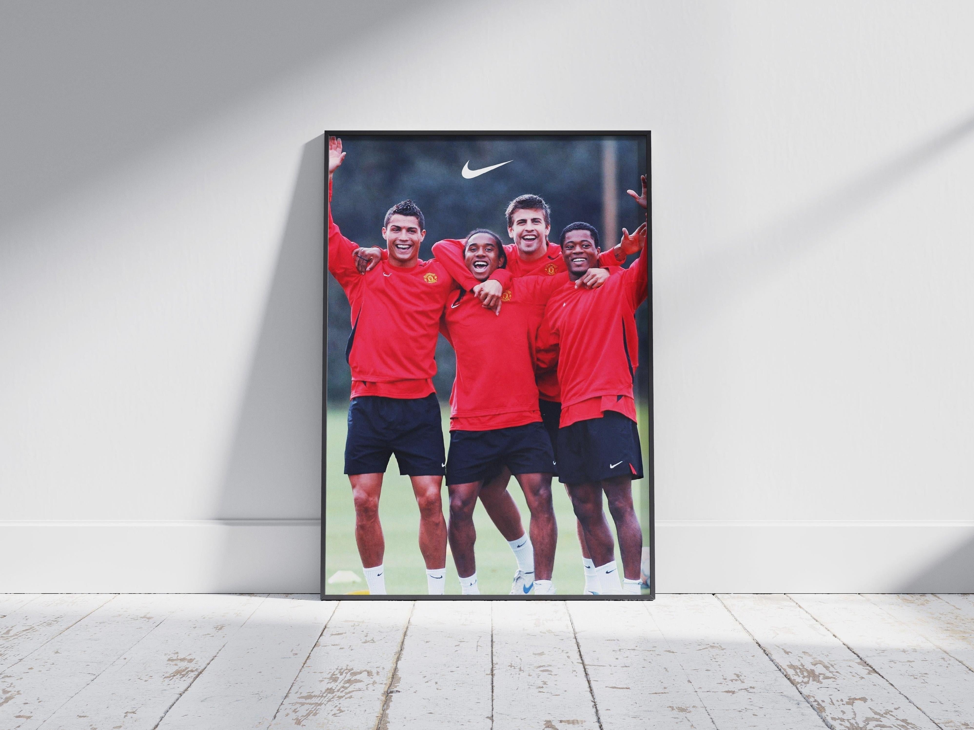 Celebrate Manchester United with the Retro1999 Ronaldo x Anderson x Pique x Evra Poster, featuring four legends in red training kits, smiling together on the pitch—a perfect collector’s item for true fans.